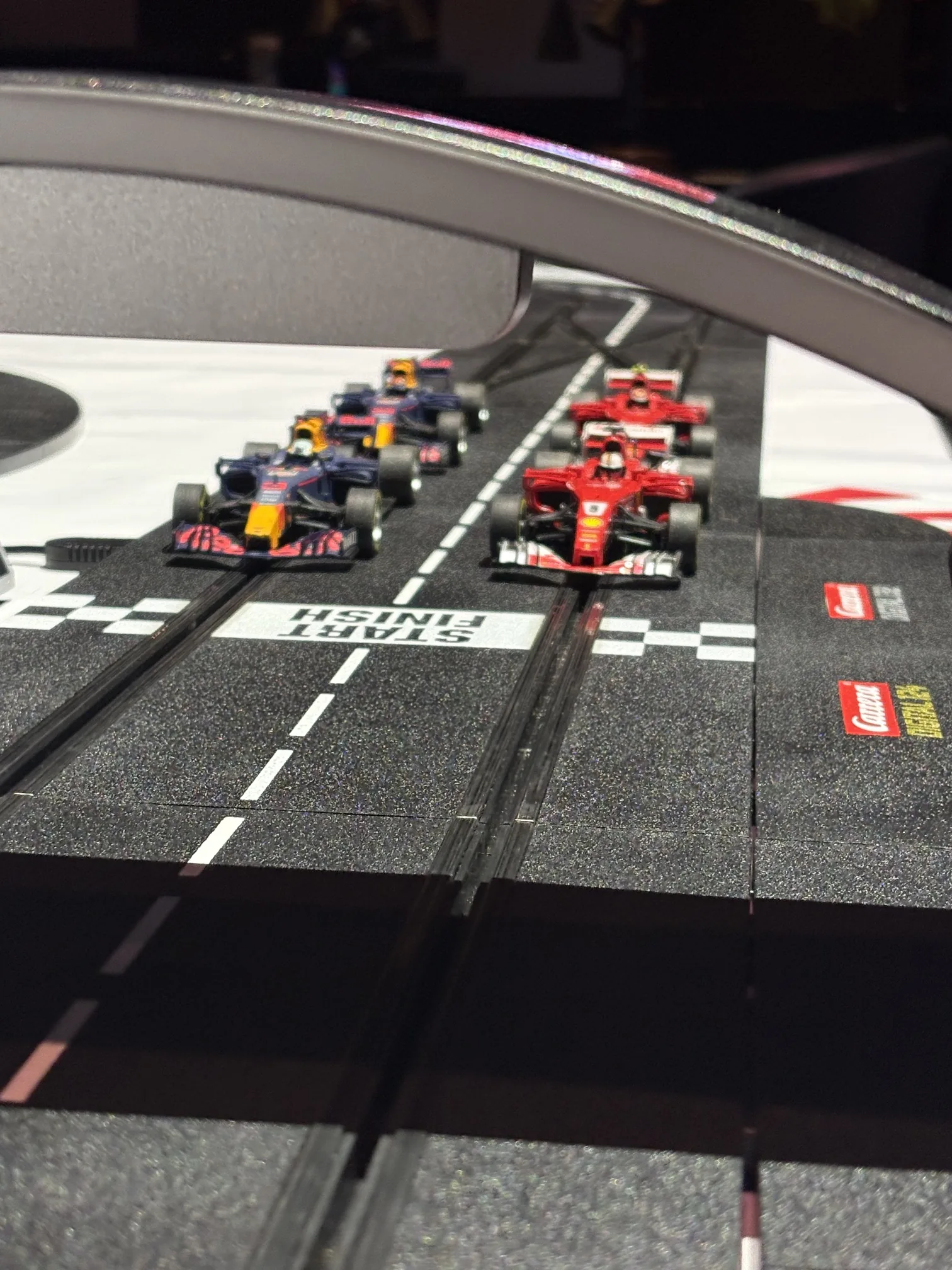 Detailed view of the digital race track and Formula cars