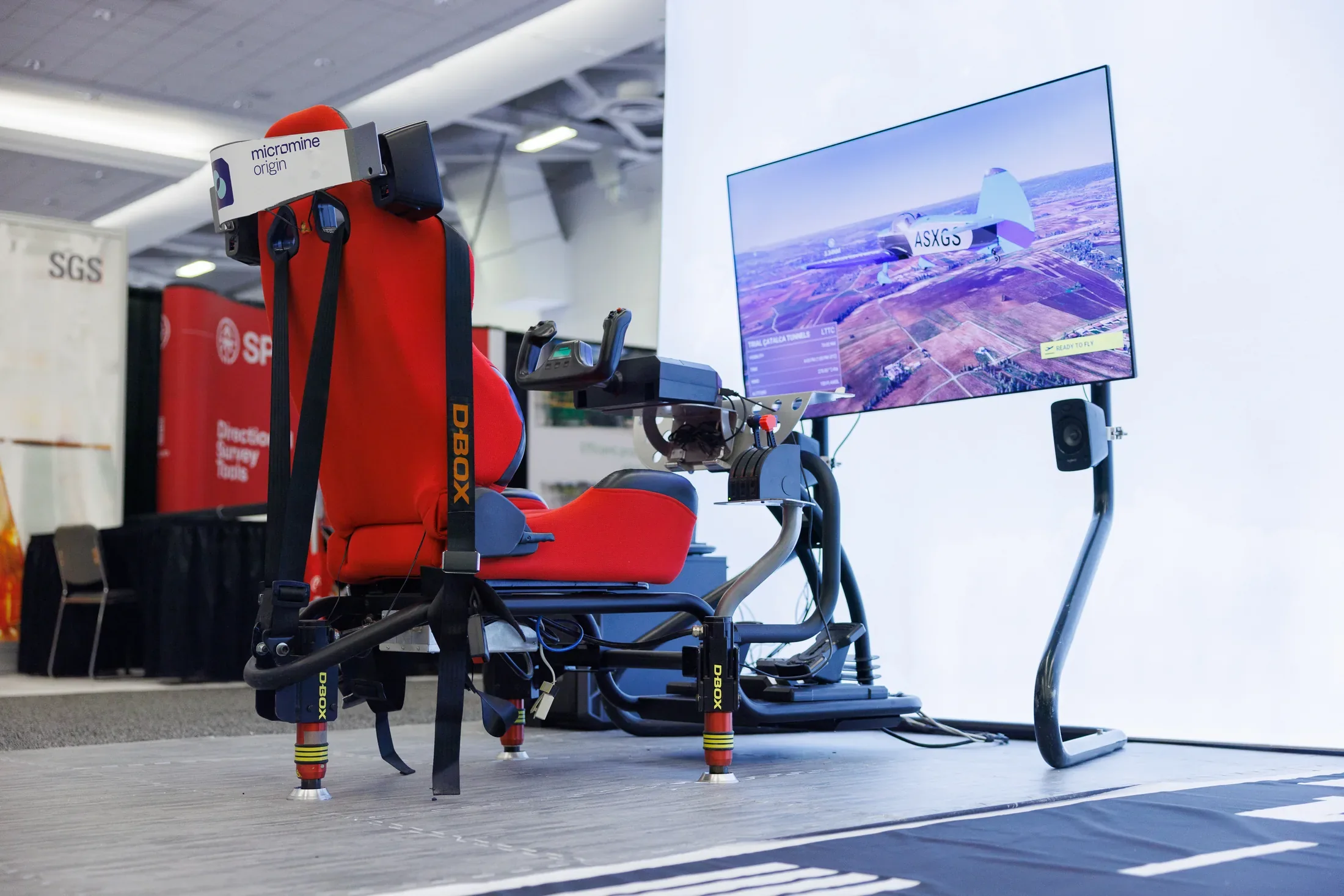 Micromine Origin flight simulator with D-BOX motion seating at AME Roundup in Vancouver