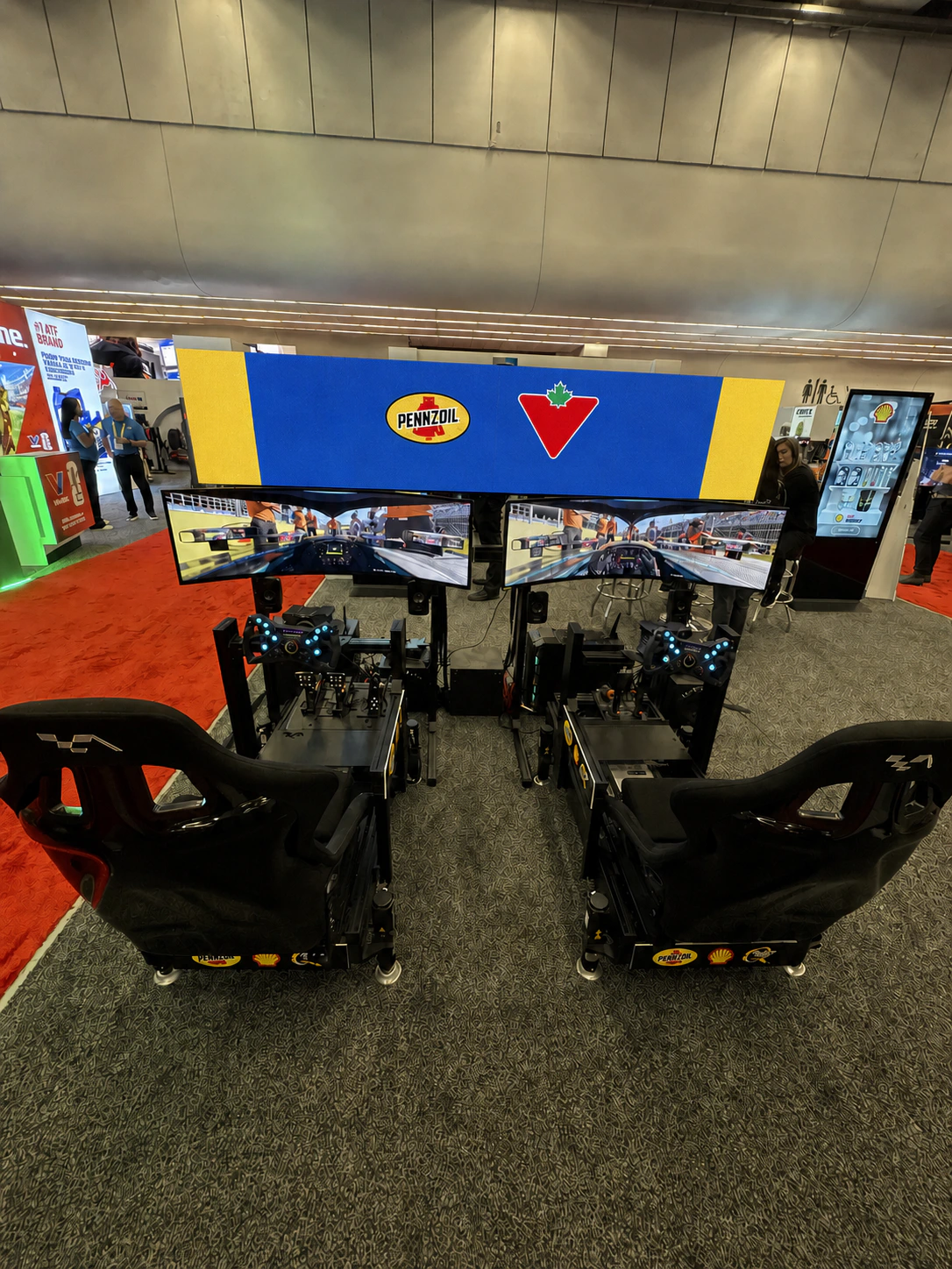 Pennzoil racing simulator activation with branded event graphics
